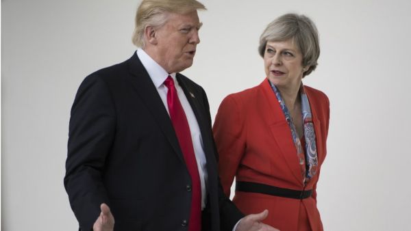 US President Donald Trump and British Prime Minister Theresa May walk at the White House on January 27, 2017 in Washington, DC. (Brendan Smialowski, AFP)