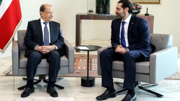 Lebanese President Michel Aoun (L) speaking with Prime Minister Saad al Hariri during a meeting at the Presidential Palace in Baabda, east of the capital Beirut. (AFP)
