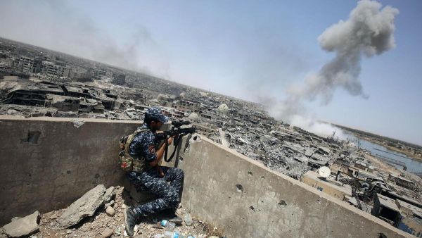An Iraqi forces sniper looks on as smoke billows, following an airstrike by US-led international coalition forces targeting ISIS in the Old City of Mosul on July 9, 2017. (AFP/ File Photo)