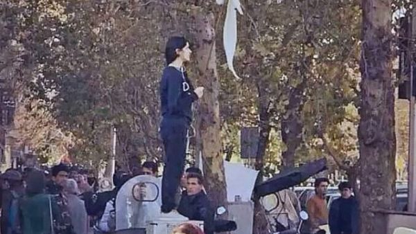 The iconic 'Girl of Enghelab Street,' Vida Movahed, who appeared in public in Tehran, Iran, in December 2017 without wearing a headscarf, as mandated by law. (YouTube screenshot)