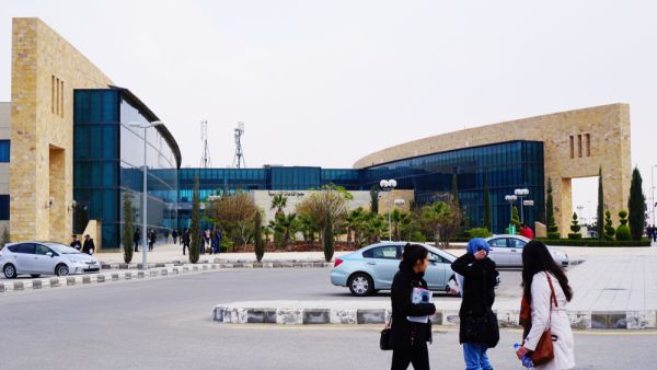 A group of students walking home from a new modern building of Jordan University Of Science and Technology(JUST) in a cold winter evening.  (Shutterstock/ File Photo)