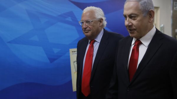 Israeli Prime Minister Benjamin Netanyahu (R) and US Ambassador to Israel David Friedman (AFP)