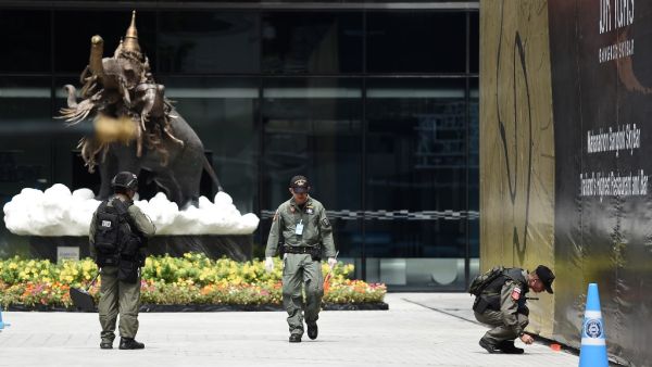 Members of the explosive ordinance disposal unit gather at the scene of an explosion in Bangkok  (AFP)