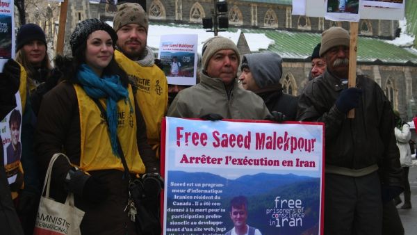 Supporters demonstrating for the release of Saeed Malekpour, in Phillips Square in Montreal, Quebec, Canada. An Iranian serving a life sentence on a conviction of designing a pornographic website. (AFP/ File Photo)