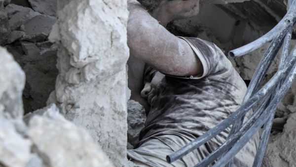 Syrian victim of a reported airstrike by regime forces on the town of Maaret Hurmah in the southern countryside of Syria's northwestern Idlib province (AFP)