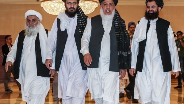 Mohammad Nabi Omari (C-L), a Taliban member formerly held by the US at Guantanamo Bay and reportedly released in 2014 in a prisoner exchange, Taliban negotiator Abbas Stanikzai (C-R), and former Taliban intelligence deputy Mawlawi Abdul Haq Wasiq (R) walk with another Taliban member during the second day of the Intra Afghan Dialogue talks in the Qatari capital Doha (AFP)