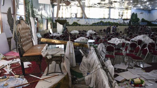Afghan men investigate in a wedding hall after a deadly bomb blast in Kabul. (AFP/ File Photo)