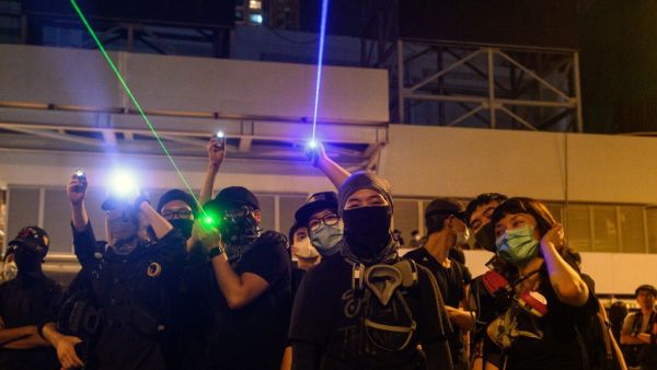 Protesters point laser beams to the police outside the Yuen Long MTR station during a protest in Hong Kong on August 21, 2019. (AFP/ File Photo)