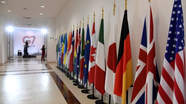 A picture shows various flags in Biarritz, south-west France on August 26, 2019, on the third day of the annual G7 Summit attended by the leaders of the world's seven richest democracies, Britain, Canada, France, Germany, Italy, Japan and the United States.  Bertrand GUAY / AFP