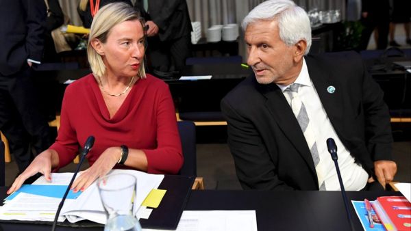 High Representative of the European Union for Foreign Affairs and Security Policy and Vice-President of the European Commission Federica Mogherini (L) and General Director of EU Council Leonardo Schiavo  (AFP)
