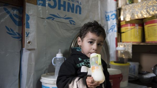 Lebanon. Syrian refugee family receiving cash assistance