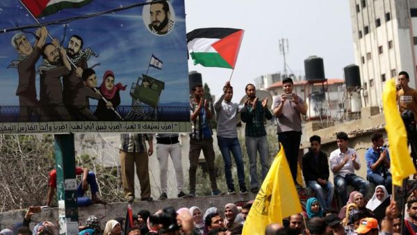 A struggle for freedom. Palestinians take part in a demonstration in support of Palestinian prisoners held in Israeli jails, on April 17. (AFP)
