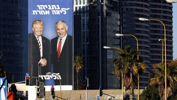 A giant election billboard of Israeli Prime Minister Benjamin Netanyahu and US President Donald Trump, with a slogan in Hebrew: "Netanyahu, in another league". (AFP /JACK GUEZ)