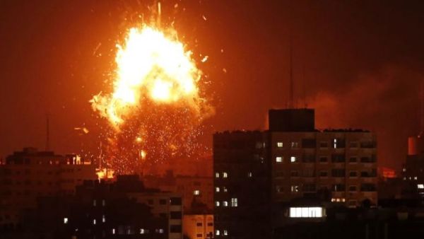 A ball of fire above the building housing the Hamas-run television station al-Aqsa TV in the Gaza Strip during an Israeli air strike on Nov 12, 2018. (AFP)