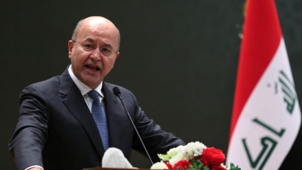 Iraqi President Barham Salih delivering a speech on 2 October, 2018 at the parliament in Baghdad (AFP)