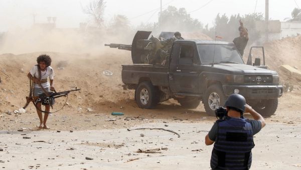 A journalist covers the frontline during clashes between forces loyal to strongman Khalifa Haftar and fighters loyal to the Libyan internationally-recognised Government of National Accord (GNA), south of the Libyan capital Tripoli on May 25,2019.  (AFP/ File Photo)