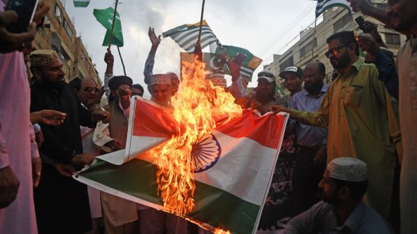Pakistani demonstrators burn and India flag and shout slogans during an anti-India protest rally in Karachi on August 30, 2019. (AFP/ File Photo)
