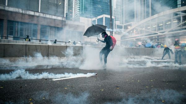 Protesters react after police fired tear gas outside the government headquarters in Hong Kong on August 31, 2019. (AFP/ File Photo)