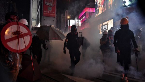 Protesters walk through a cloud of teargas as they occupy Hennessy Road in Hong Kong on August 31, 2019. (AFP/ File Photo)