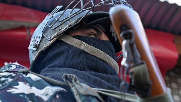 An Indian paramilitary trooper stands guard during heavy restrictions on movements in Srinagar  (AFP)