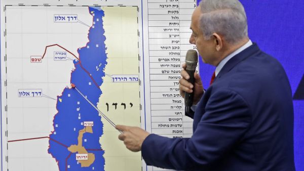 Israeli Prime Minister Benjamin Netanyahu points at a map of the Jordan Valley as he gives a statement in Ramat Gan, near the Israeli coastal city of Tel Aviv, on September 10, 2019. (AFP/ File Photo)