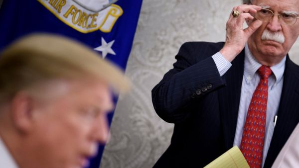 John Bolton listens while US President Donald Trump (AFP)