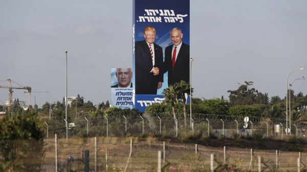 This picture taken on September 9, 2019 shows Israeli election billboards in the Israeli coastal city of Tel Aviv (R to L) for the Likud party showing US President Donald Trump shaking hands with Likud chairman and Prime Minister Benjamin Netanyahu  (AFP)