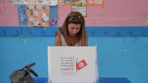 A Tunisian voter fills her ballot for presidential election at a polling station in La Marsa on the outskirts of the capital Tunis, on September 15, 2019. (AFP/ File Photo)