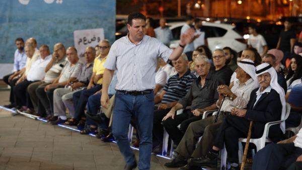 The head of the mainly Arab Joint List alliance Ayman Odeh gestures to supporters during an electoral campaign rally in the northern Arab-Israeli town of Sakhnin on September 15, 2019. (AFP/ File Photo)