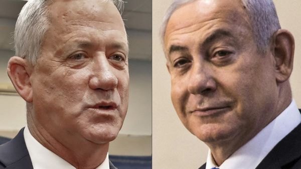 This combination picture created on September 18, 2019 shows Retired Israeli General Benny Gantz (L), leader and candidate of the Israel Resilience party that is part of the Blue and White (Kahol Lavan) political alliance, speaking to journalists after voting during Israel's parliamentary election at a polling station in Rosh Haayin, and Israeli Prime Minister Benjamin Netanyahu (R) smiling after casting his vote at a polling station in Jerusalem (AFP)