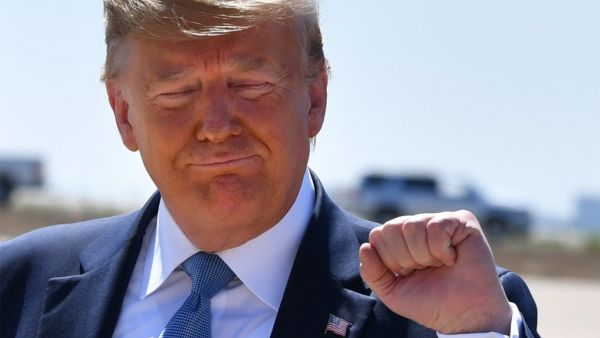 US President Donald Trump gestures after landing at San Diego International Airport in San Diego, California, on September 18, 2019. Trump is in San Diego for a fundraiser and a border visit. (Nicholas Kamm / AFP)