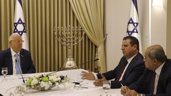 Israeli President Reuven Rivlin listens to members of the Joint List Ayman Odeh (2nd-R) and Ahmad Tibi (R) during a consulting meeting, to decide who to task with trying to form a new government, in Jerusalem on September 22, 2019. (Menahem KAHANA / AFP)