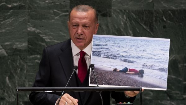 Turkey's President Recep Tayyip Erdogan holds up a photo as he speaks during the 74th Session of the United Nations General Assembly at UN Headquarters in New York, September 24, 2019. (Johannes EISELE / AFP)