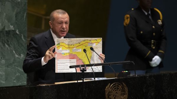 Turkey's President Recep Tayyip Erdogan holds up a map as he speaks during the 74th Session of the United Nations General Assembly at UN Headquarters in New York, September 24, 2019. (Don Emmert / AFP)
