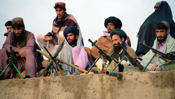 Afghan Taliban fighters listen to Mullah Mohammad Rasool Akhund (unseen), the newly appointed leader of a breakaway faction of the Taliban, at Bakwah in the western province of Farah. (AFP/ File Photo)