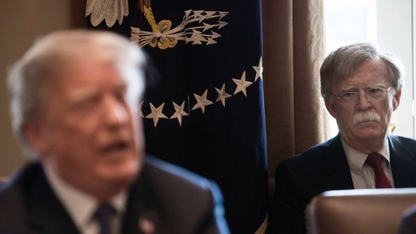 National Security Adviser John Bolton(R) listens to US President Donald Trump speak during a cabinet meeting at the White House in Washington, DC. (AFP/ File Photo)