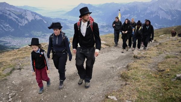 Dozens of people dressed in black went on a "funeral march" up a steep Swiss mountainside on Sunday to mark the disappearance of an Alpine glacier amid growing global alarm over climate change (Twitter)