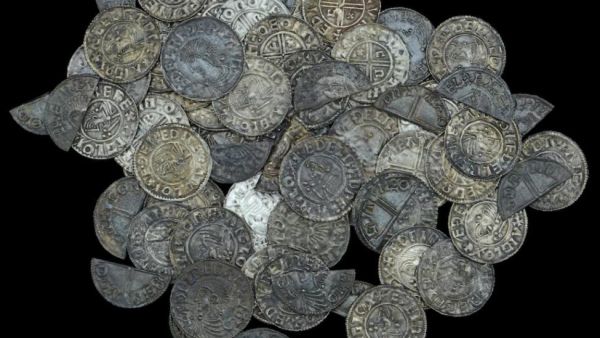 A British man with a metal detector found nearly 100 silver pennies dating back 1,000 years on a farmer's property. (Photo courtesy of Dix Noonan Webb Auctions)