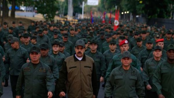 Venezuela’s president, Nicolás Maduro, (C) with defence minister Vladimir Padrino (left) and members of the military in Caracas, on Thursday. (Miraflores press office handout/AFP/Getty Images)