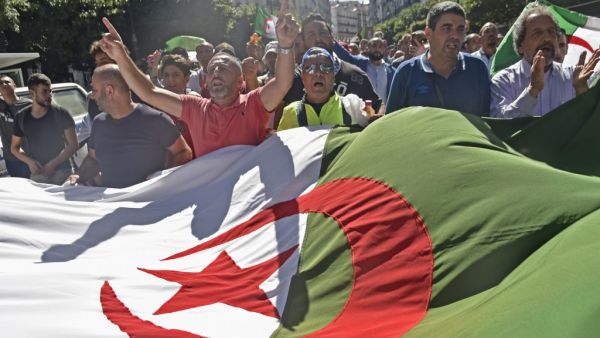 Algerian protesters chant slogans during a demonstration against the ruling class in the capital Algiers on October 4, 2019, for the 33rd consecutive Friday since the movement began. (Ryad KRAMDI / AFP)