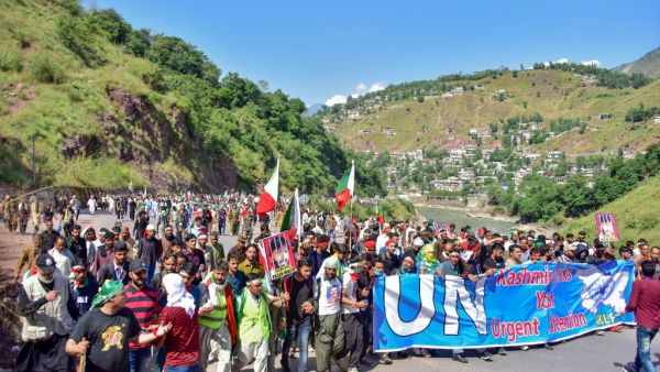 Kashmiri people march towards the border town of Chokathi to protest against the Indian government lockdown of Indian-controlled Kashmir, in Muzaffarabad on October 5, 2019. (AFP/ File Photo)