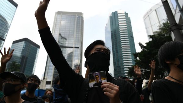 Masked protesters gather outside the High Court premises in support of activist Edward Leung, jailed for taking part in the 2016 Mongkok riots, during an appeal hearing for his period of sentence in Hong Kong on October 9, 2019. (AFP/ File Photo)