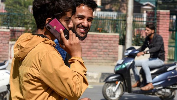 Mobile phone networks were restored in Indian Kashmir on October 14 after a 72-day blackout, authorities said, but the internet remained off-limits for the region's some eight million people. (HABIB NAQASH / AFP)