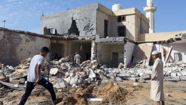 Libyans check the site of an air strike in which three children were killed and others wounded on the southern outskirts of the capital Tripoli on October 14, 2019. (AFP/ File Photo)