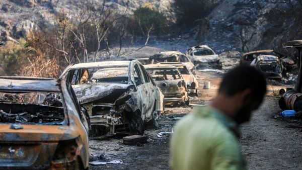 Firefighters extinguish flames in a forest near the village of Meshref in Lebanon's Shouf mountains, southeast of the capital Beirut, on October 15, 2019.  (AFP/ File Photo)