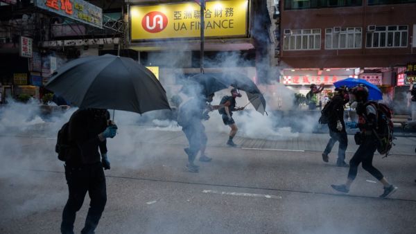 ge crowds of Hong Kongers defied a police ban and began an illegal march on October 20, their numbers swollen by anger over the recent stabbing and beating of two pro-democracy protesters.  (Ed JONES / AFP)