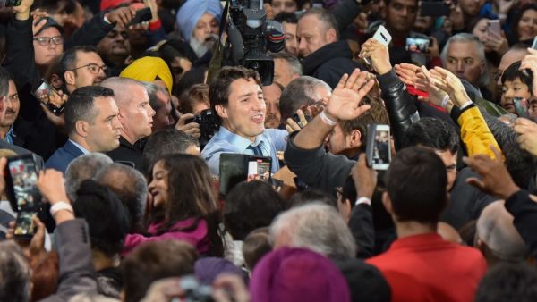 Leader of the Liberal Party of Canada, Prime Minister, Justin Trudeau, greets his supporters during a "Team Trudeau 2019" Rally at the Woodward’s Atrium in Vancouver B.C. on October 20, 2019. (Don MacKinnon / AFP)