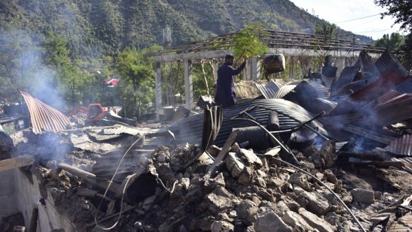 A Kashmiri resident removes wreckage of their damaged house after cross border shelling in Jura, a village of Neelum valley in Pakistan-administered Kashmir on October 21, 2019. (AFP/ File Photo)
