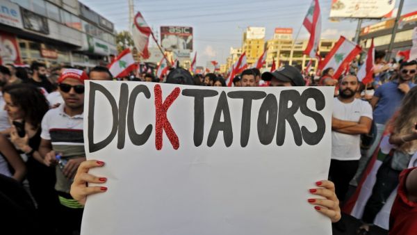 Lebanese protesters take to the streets during demonstrations to demand better living conditions and the ouster of a cast of politicians who have monopolised power and influence for decades, on October 21, 2019, north of Beirut. Lebanon's teetering government met today to approve a belated economic rescue plan as thousands gathered for a fifth day of mass protests against the ruling elite. JOSEPH EID / AFP