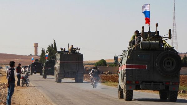 A convoy of Russian military vehicles drives toward the northeastern Syrian city of Kobane on October 23, 2019. Russian forces in Syria headed for the border with Turkey today to ensure Kurdish fighters pull back after a deal between Moscow and Ankara wrested control of the Kurds' entire heartland. AFP